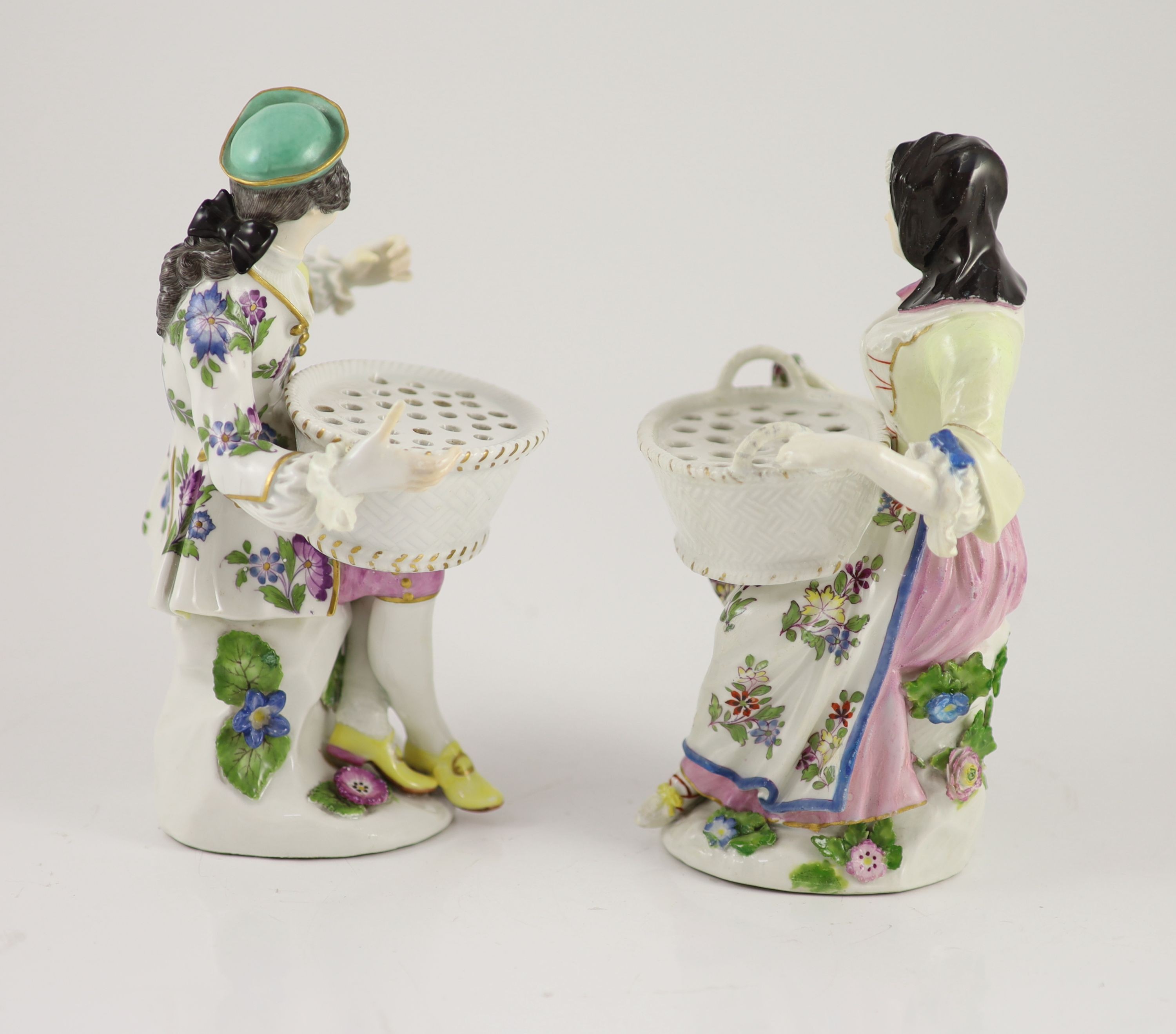 A pair of Meissen figural flower holders c.1755, 20cm and 19.5 cm high, restoration